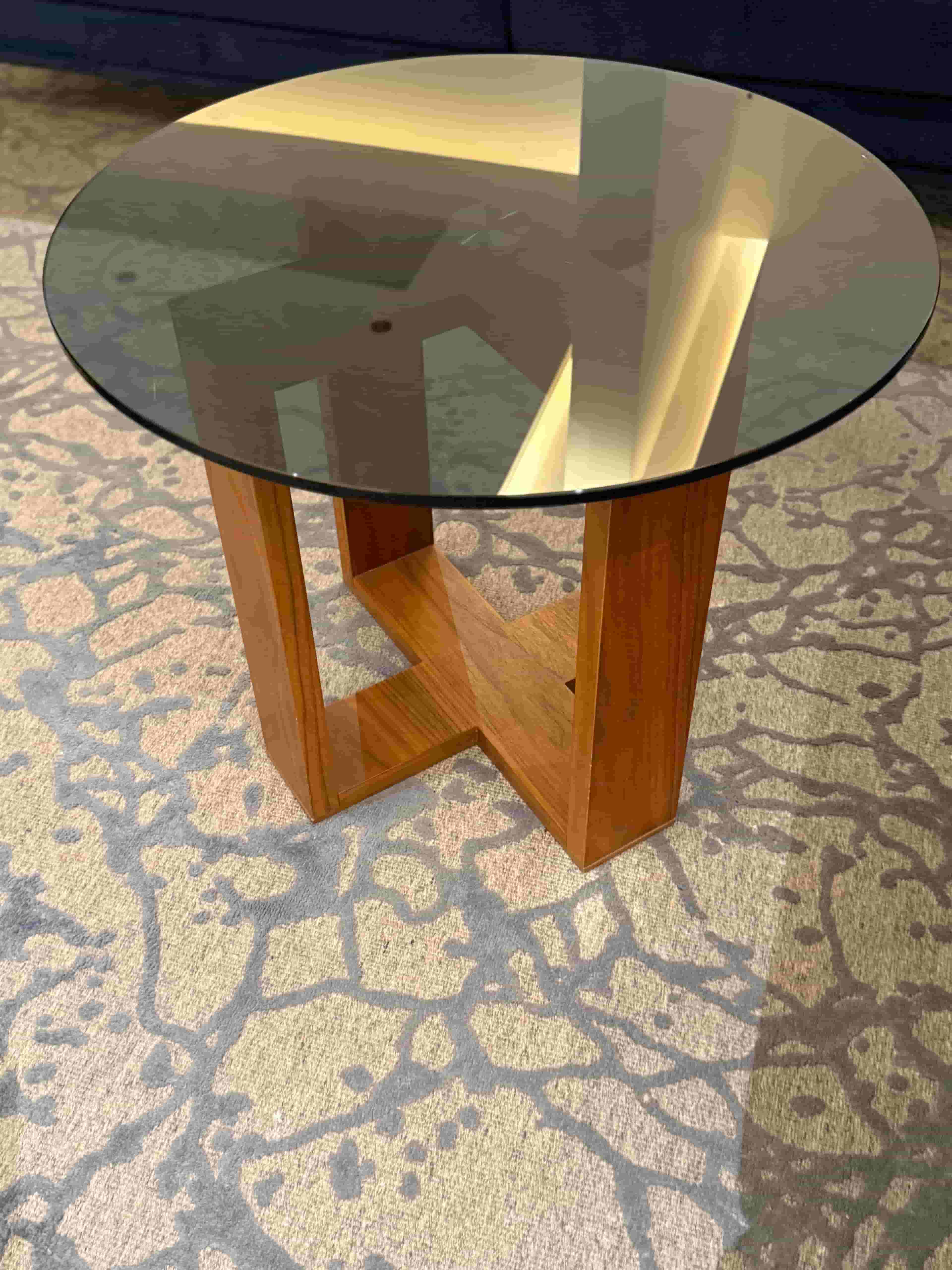 2 wooden corner tables with a black glass top