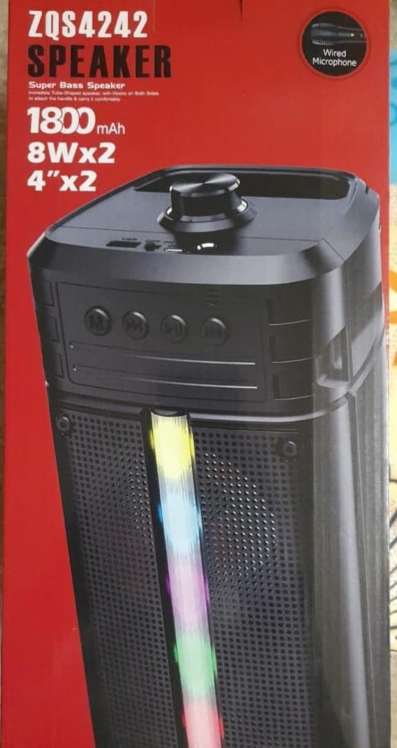 A large illuminated speaker with a mic